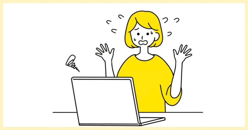 パソコンの削除ボタンを見て不安そうな表情の女性